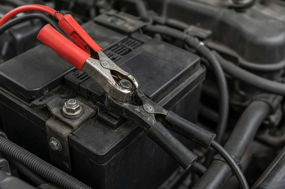Jumper cables on a battery terminal