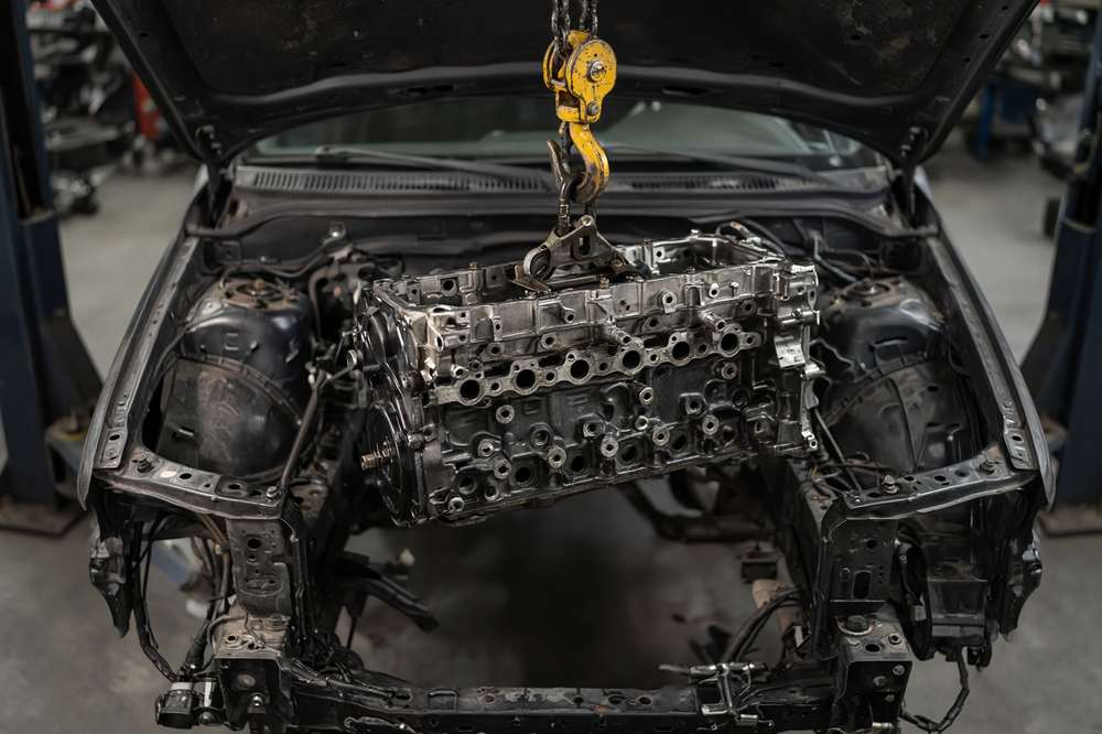 Engine being installed with a hoist
